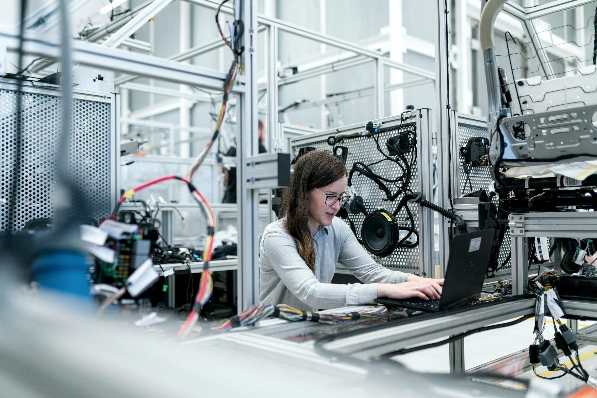 Engineer reviewing technical documentation in an industrial setting
