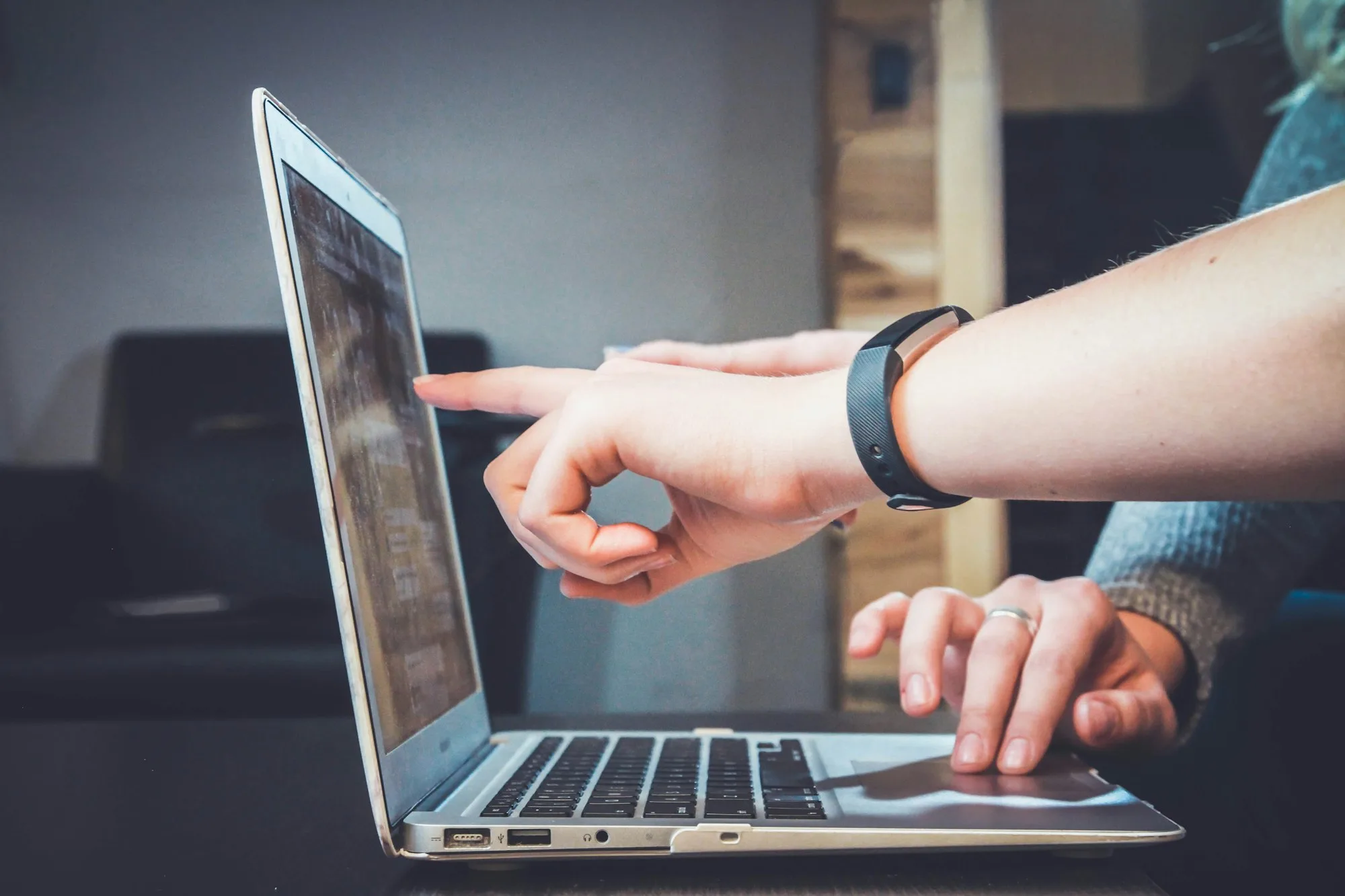 Team reviewing a digital interface on a laptop — illustrative context, not a client deliverable