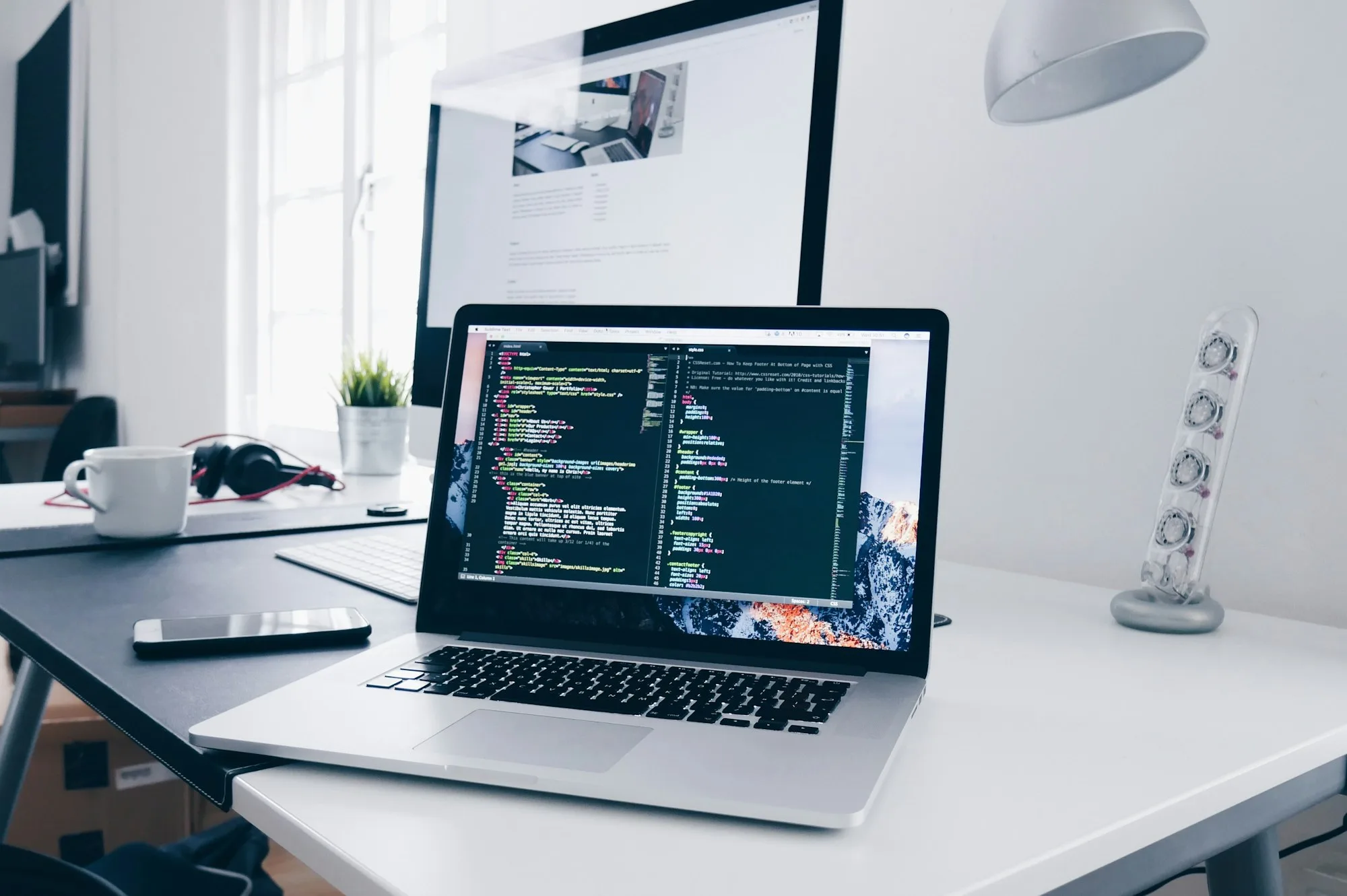 Laptop on a desk during digital product work — illustrative context, not a client deliverable
